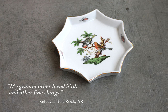 A porcelain ash try with birds on it